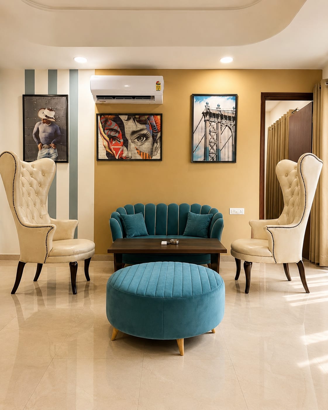 A living room with blue furniture and a blue ottoman